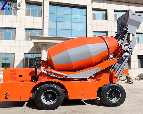 side view of self‑loading concrete mixer truck